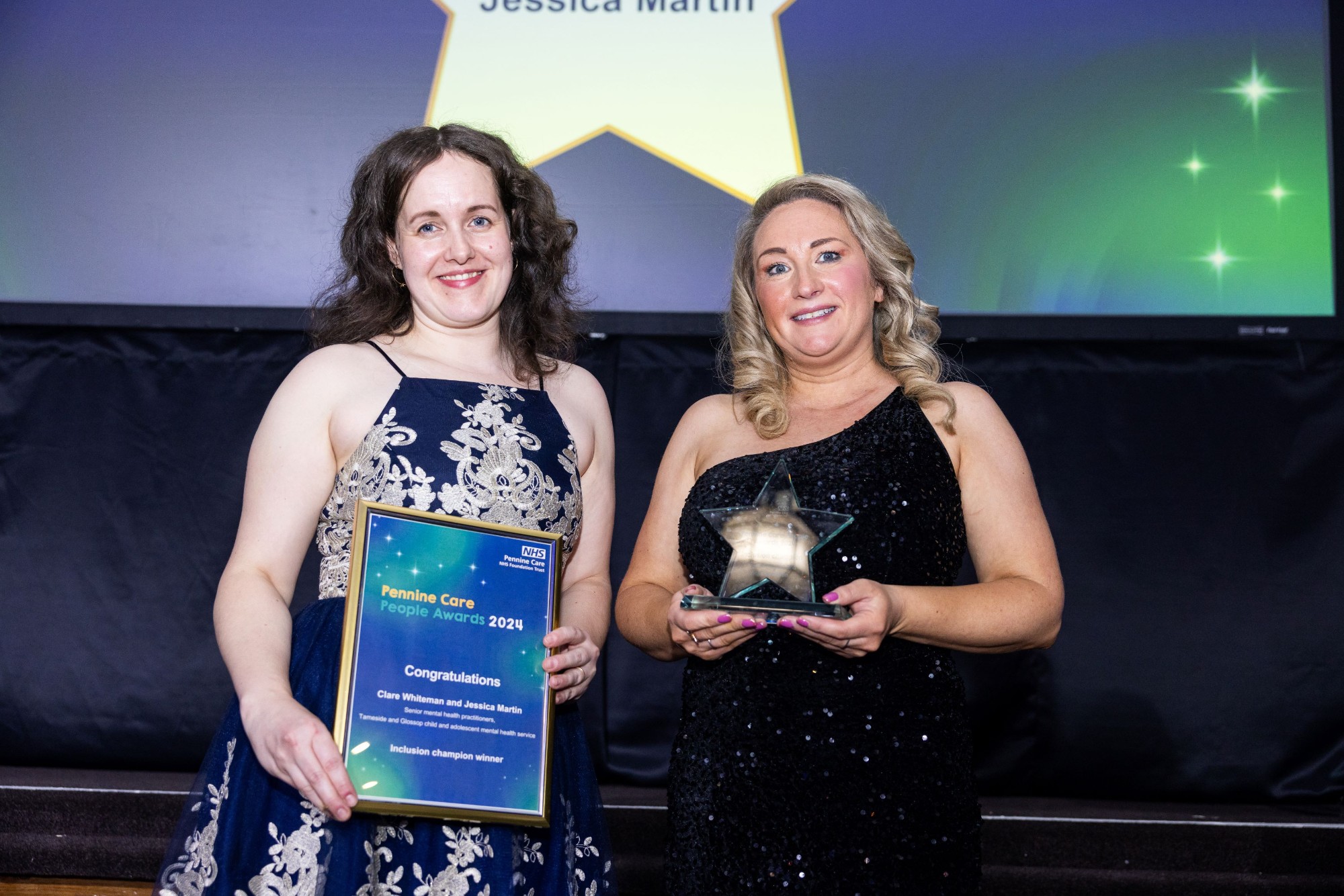 Photo of award winners with certificate and trophy