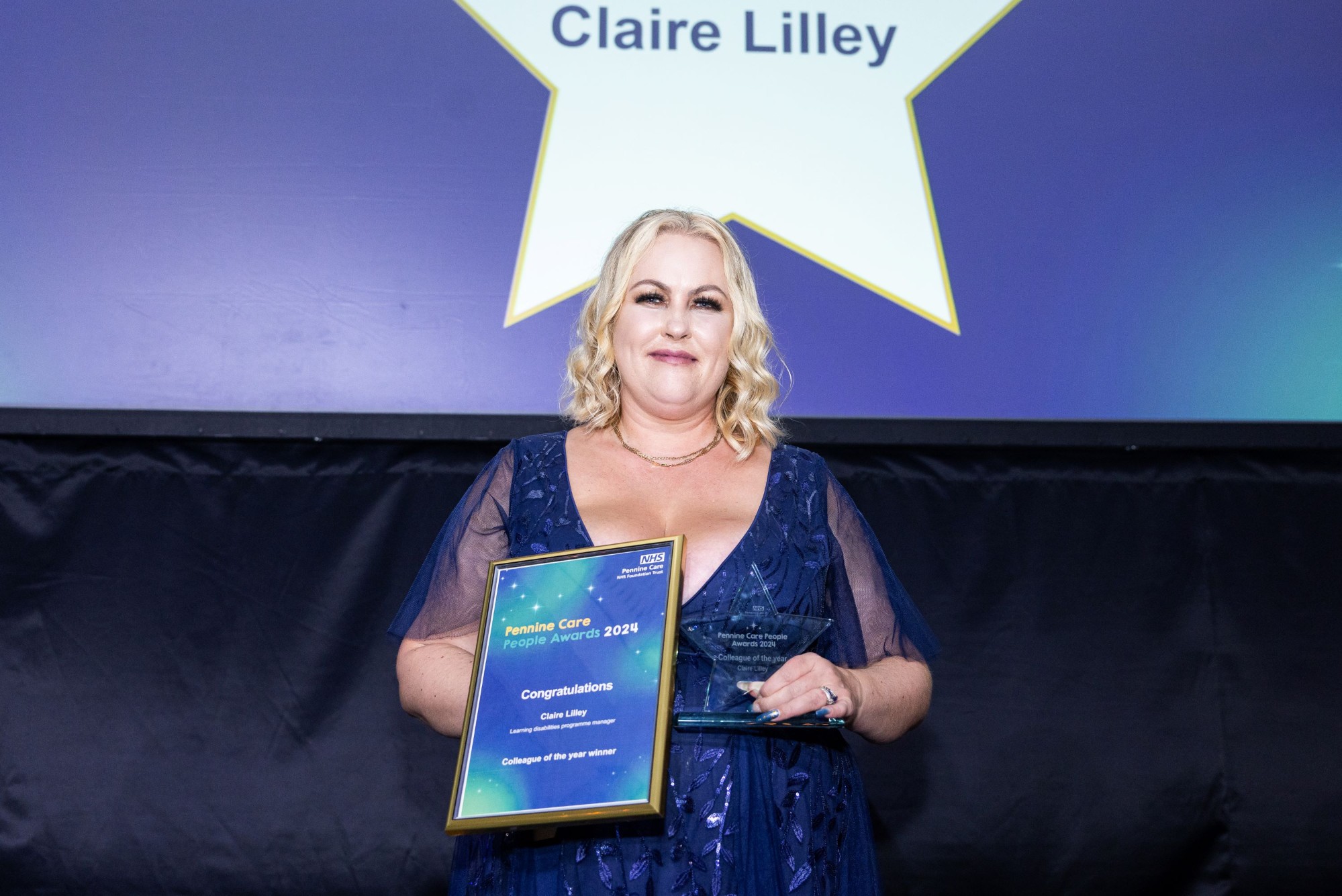 Photo of award winner Claire Lilley with certificate and trophy